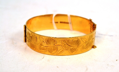 A 9ct gold bangle