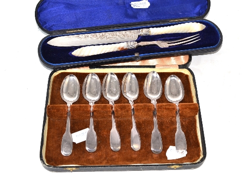 A cased Victorian mother-of-pearl handled cake knife and fork and a cased set of six fiddle and