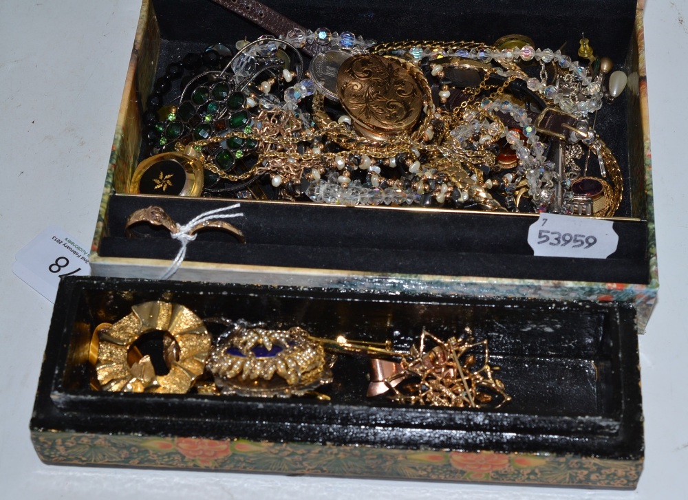 A quantity of costume jewellery including beads, brooches, watches, etc and a 9ct gold buckle