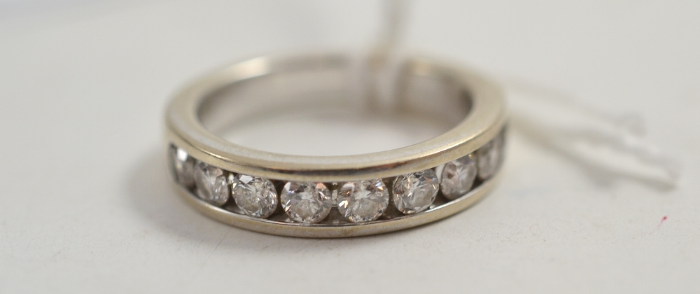 An 18ct white gold diamond half eternity ring, total estimated diamond weight 0.90 carat