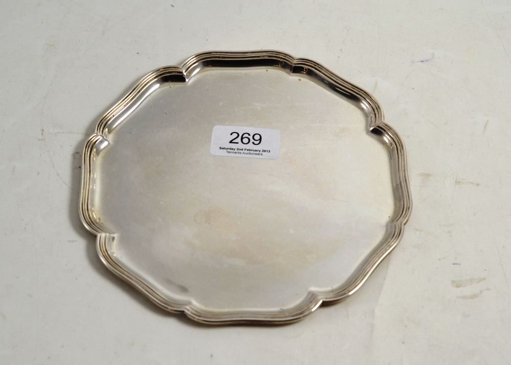 A Dutch white metal circular salver with bracketed edge, 18cm diameter