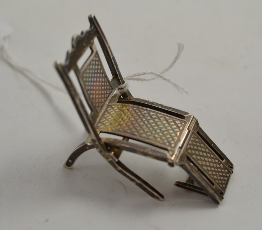 A sterling folding steamer chair by Howard & Co.