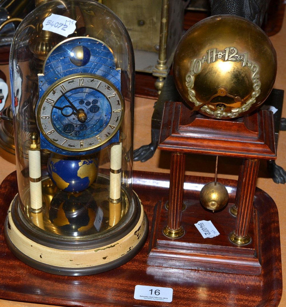 A Kaiser four hundred day mantel timepiece with enamelled dial and globe pendulum on a plinth