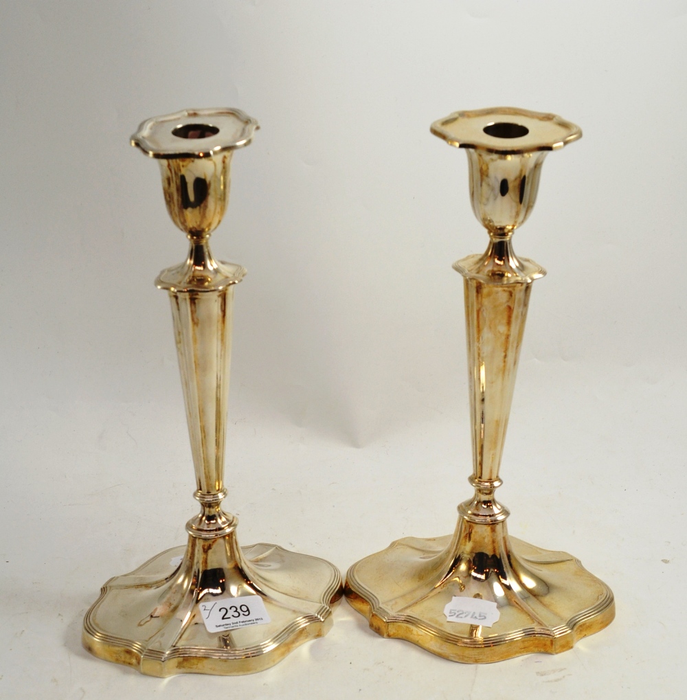 A pair of Walker & Hall silver candlesticks