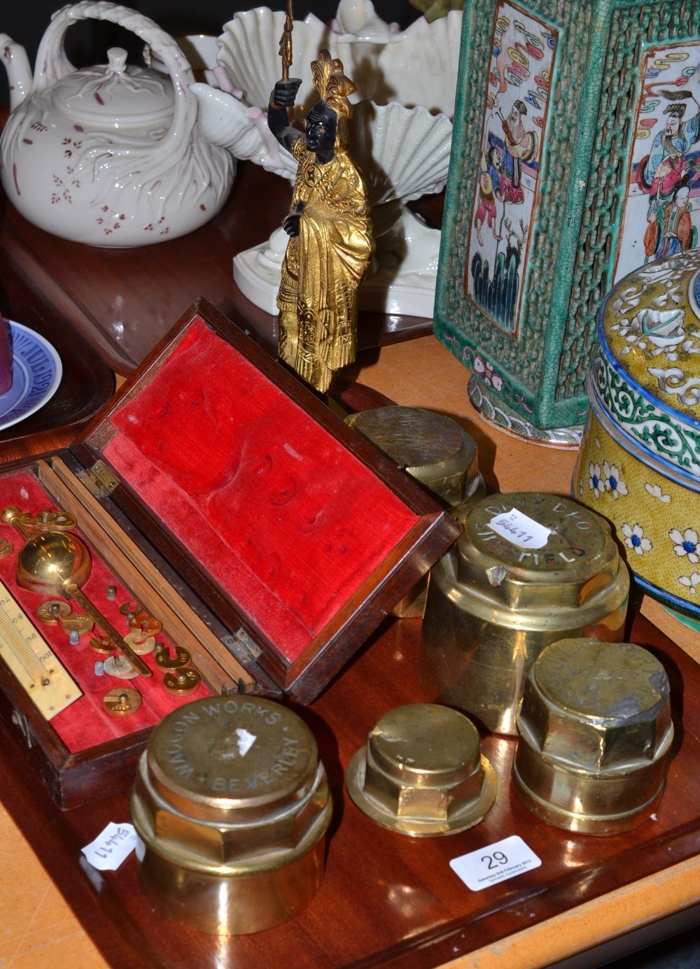 Mahogany cased Sikes Hydrometer, five brass wheel hubs and a gilt metal figure of a North American