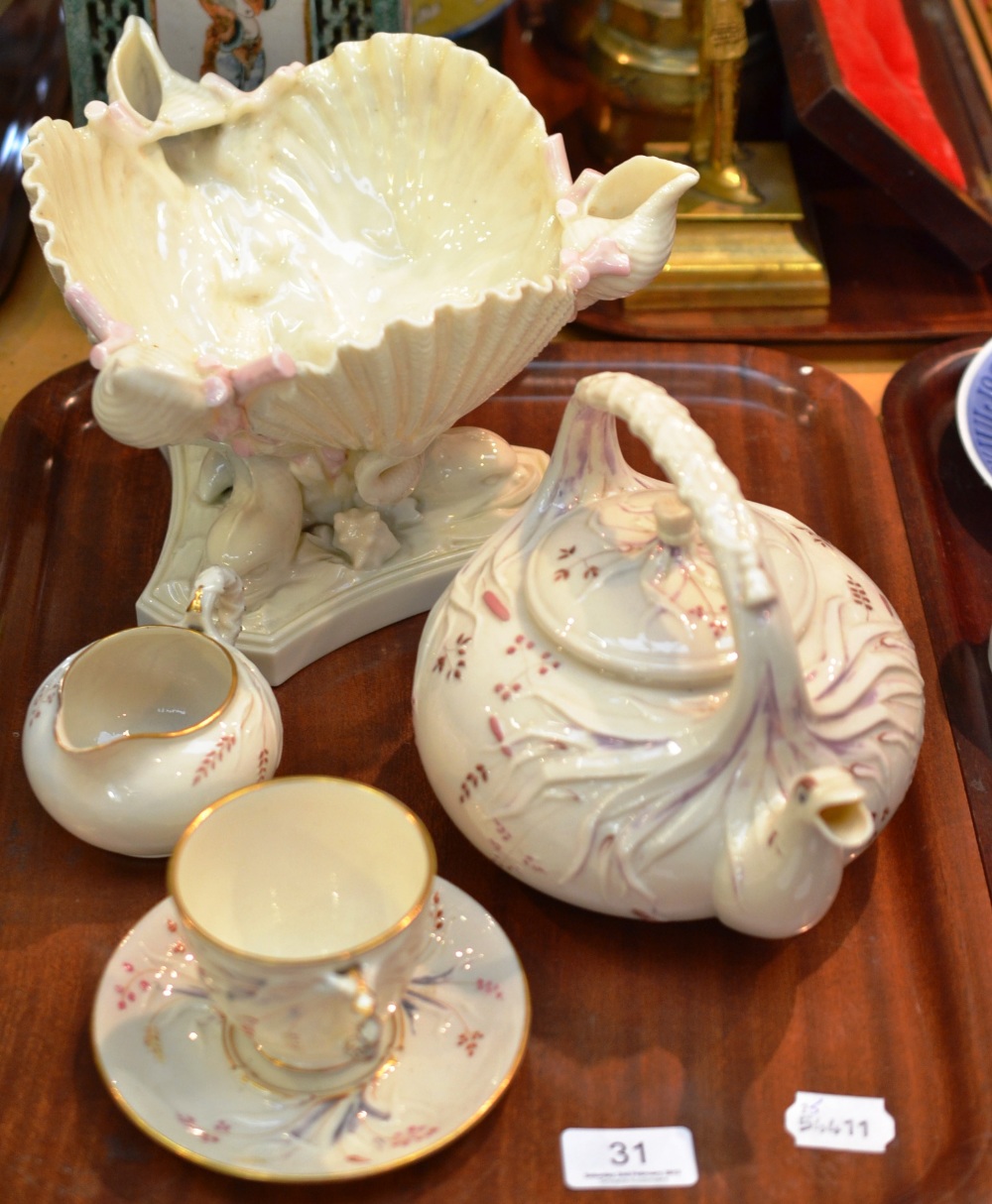 Belleek moulded teapot and cover decorated in pink with matching tea cup and saucer, milk jug and