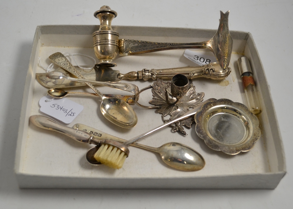 A pair of silver sardine tongs, silver flatware, silver chamber stick, pepperette, etc