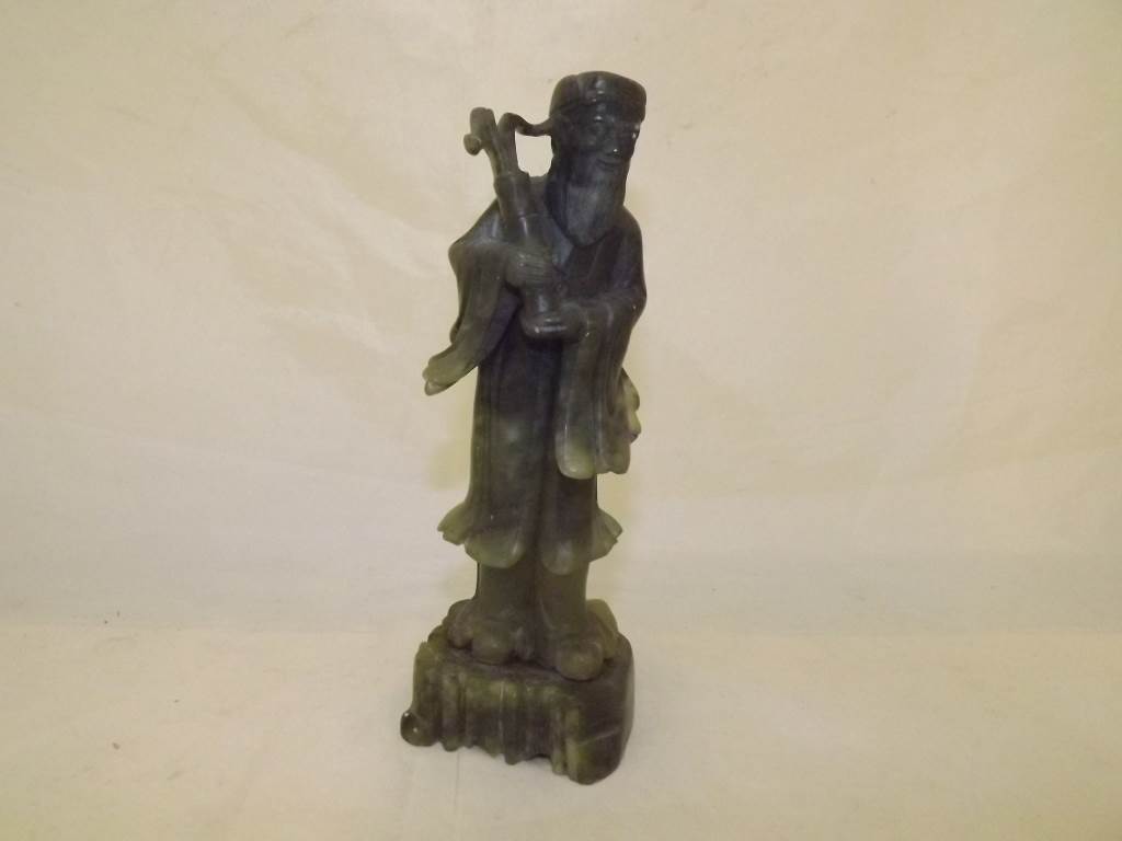 A natural stone jade Oriental figurine 19cm (h)