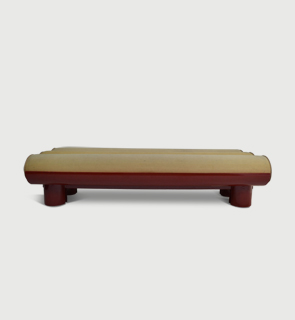 Lacquer daybed Italy c,1970 A bent plywood daybed on four cylindrical feet finished in an ox-blood