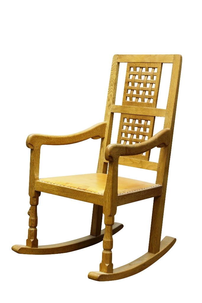 A Robert "Mouseman" Thompson oak rocking chair, the rectangular back with twin lattice panels