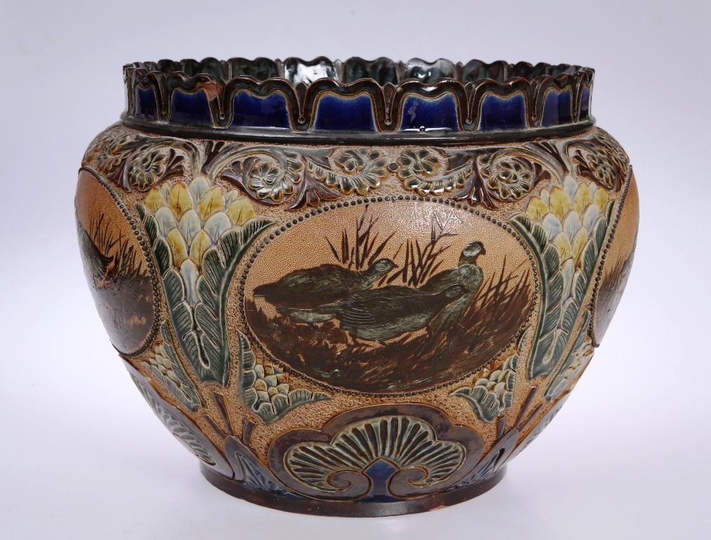 A large Doulton Lambeth stoneware jardiniere, circa 1880's the bulbous body with five beaded