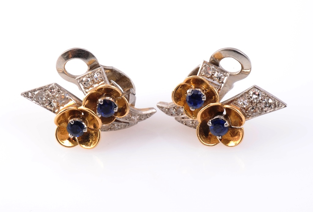 A pair of sapphire and diamond clips, circa 1940, the circular mixed-cut sapphires claw set, each