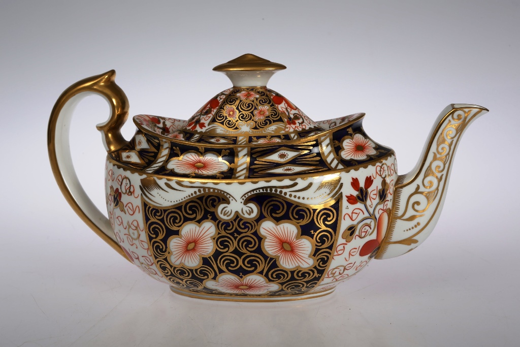 A Royal Crown Derby teapot, the oval body decorated in an Imari palette with pattern no. 2451,