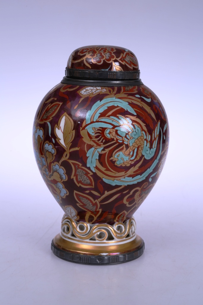 An unusual 19th century porcelain vase, the baluster body painted and gilded with a phoenix amidst