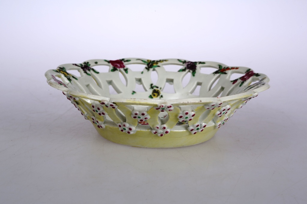 A rare Worcester yellow ground porcelain basket, circa 1768-70, of circular form, pierced with