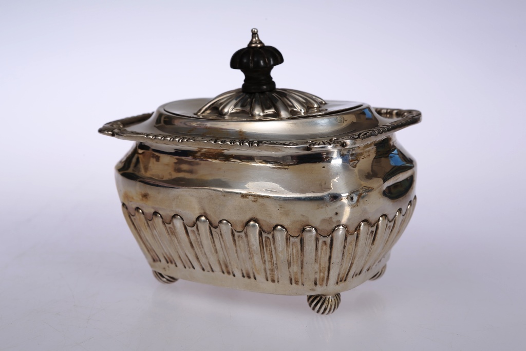 A late Victorian silver caddy, Sheffield 1894, maker C F, of shouldered and rounded rectangular form