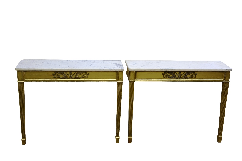 A pair of Adam style marble topped and giltwood pier tables, the rectangular marble tops above a