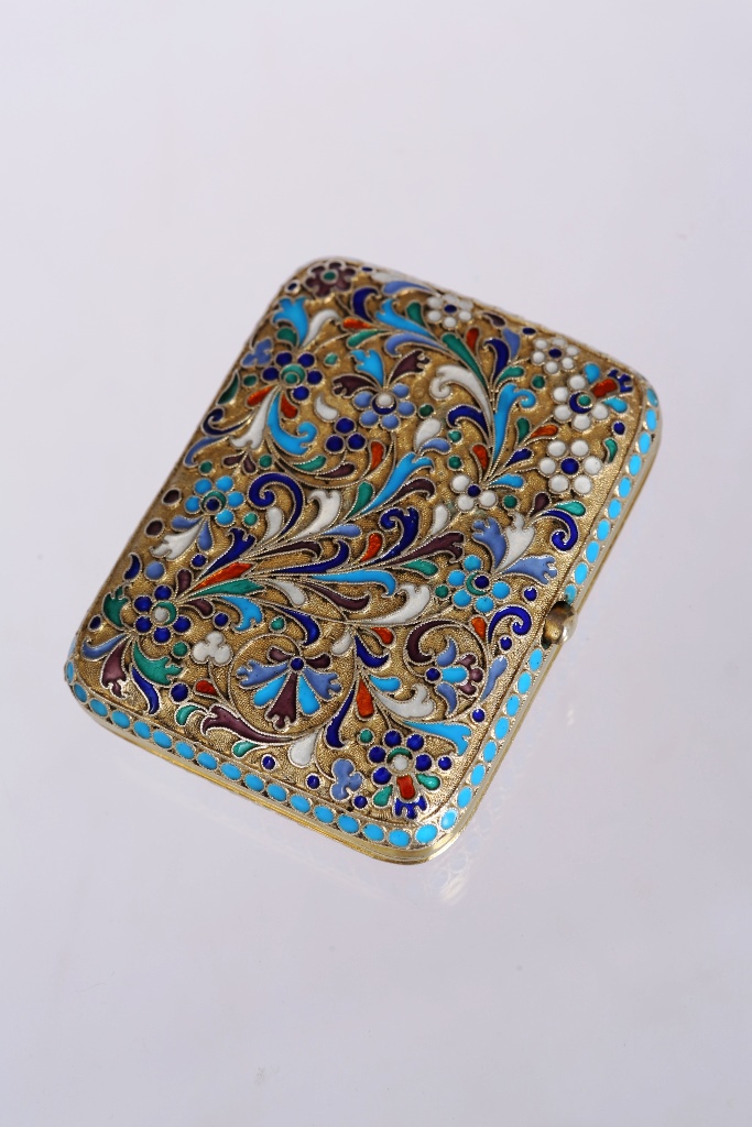 A Russian silver and polychrome enamel cigarette case, of rectangular form with rounded corners,