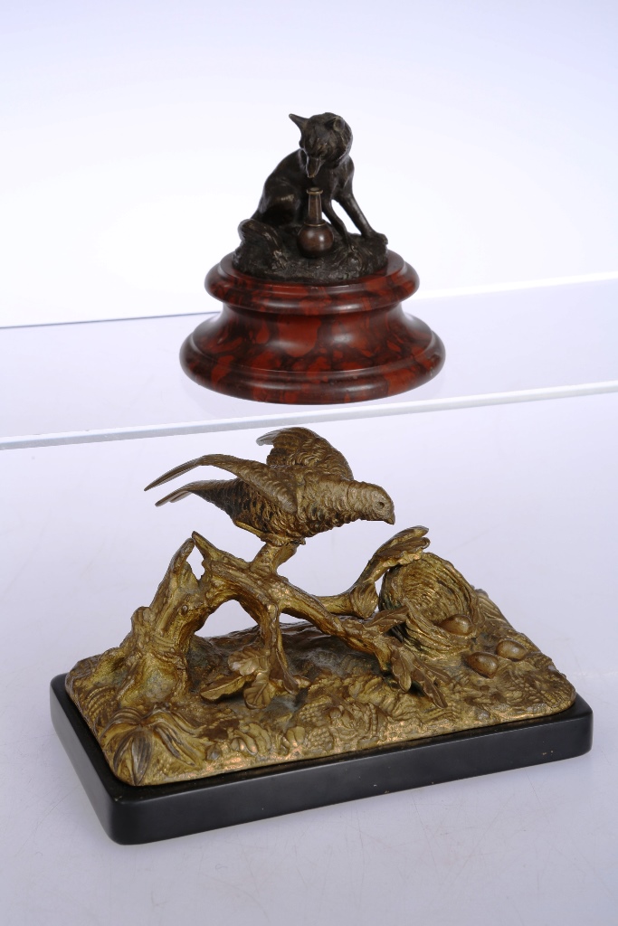 A small 19th century bronze, based on the fox from Aesop's Fables, on a turned marble plinth. 7.5cm