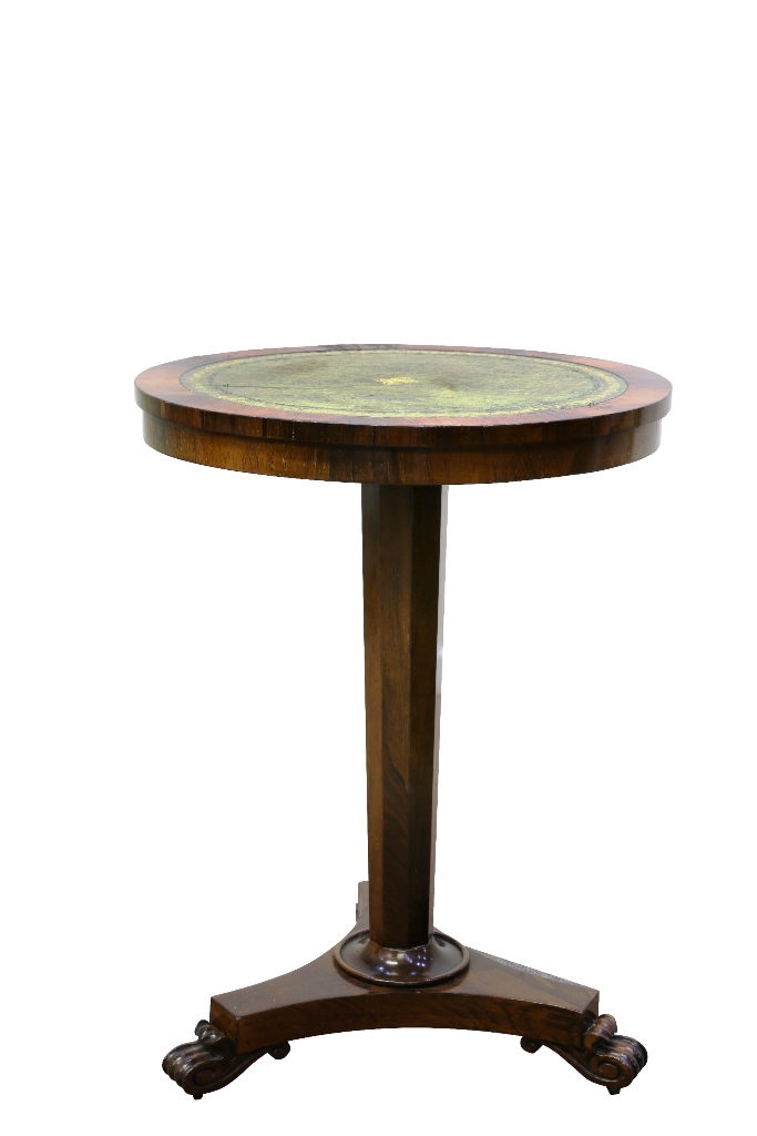 A Regency leather inset rosewood occasional table, the circular gilt tooled leather inset top