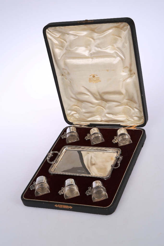 A silver liqueur set, the two handled tray, James Dixon & Son, Sheffield 1905; the six glasses