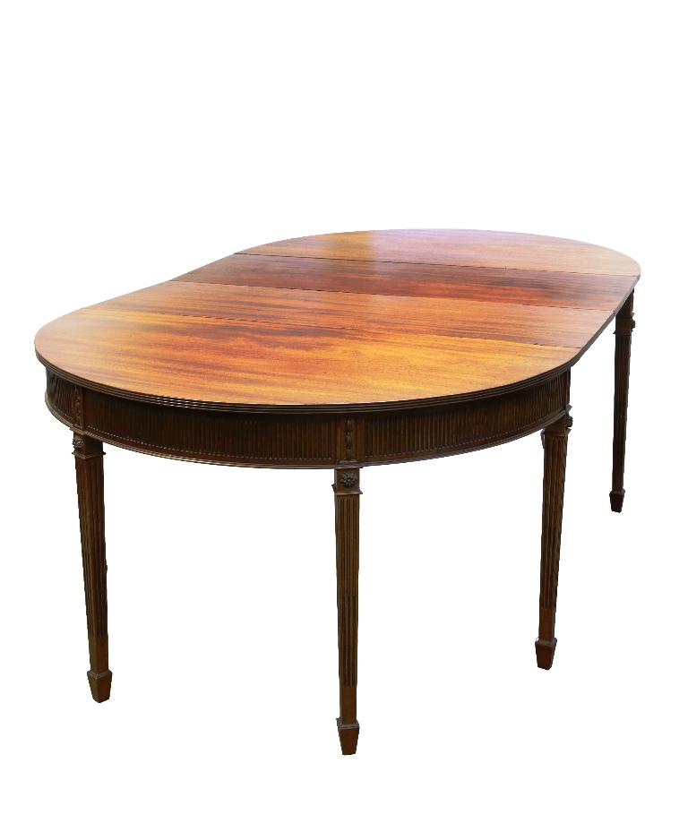 A George III style mahogany D-end dining table, each demilune end with dropleaf, reeded edge and