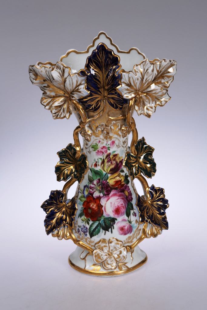 A Continental 19th century porcelain vase, boldly moulded with leafy vines, painted with a floral