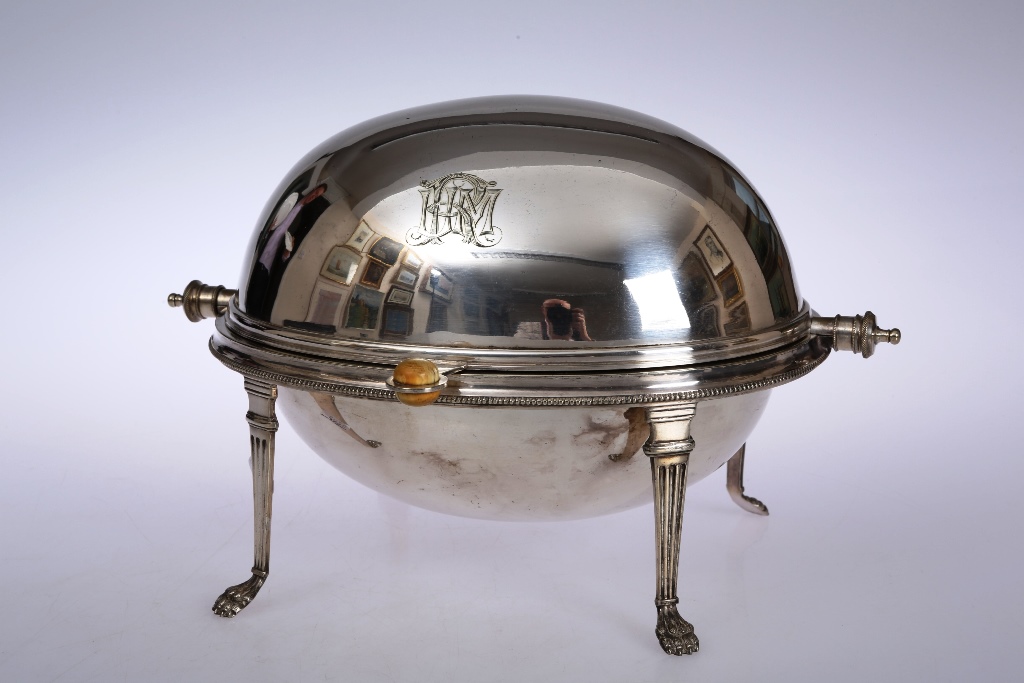 A silver plated breakfast dish, the oval turnover top, engraved with a monogram, above a beaded rim,