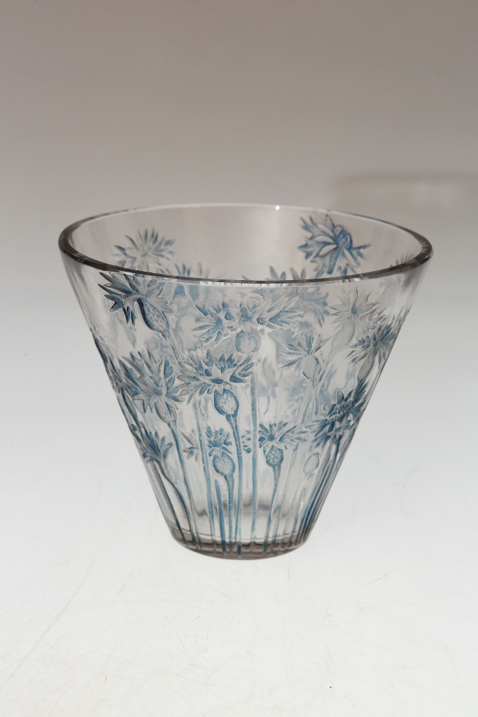 A Lalique "Bluets" pattern vase, the tapering body moulded with blue stained flowers, etched mark