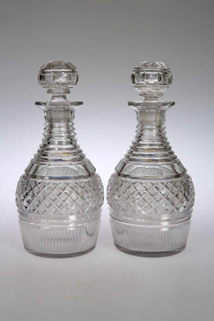 A pair of Regency cut glass decanters and stoppers, of baluster form, with a stepped neck over a