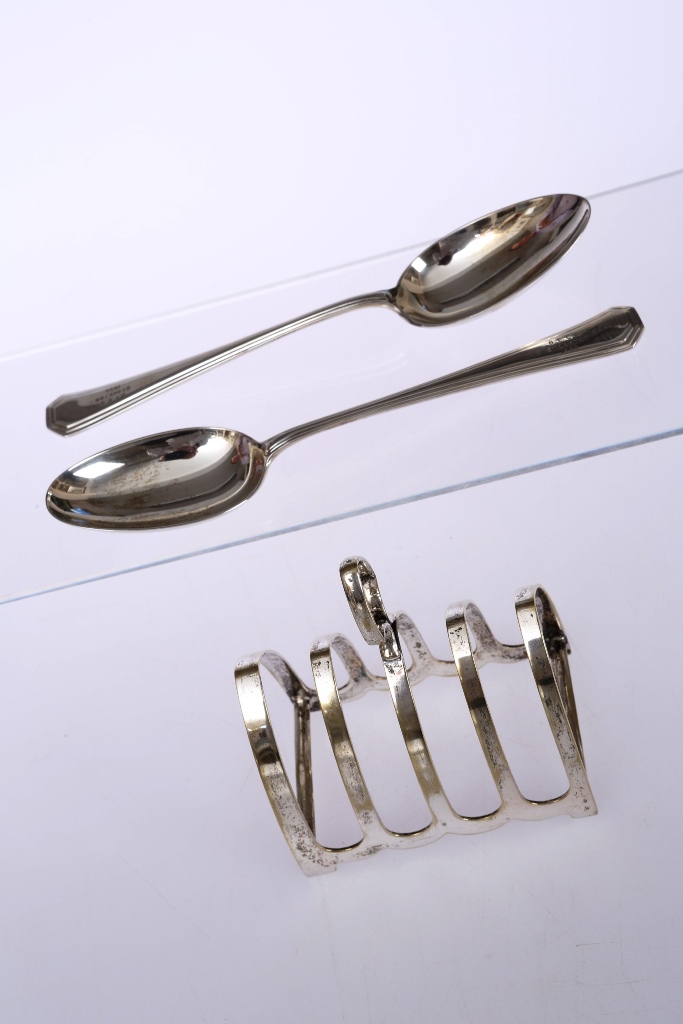 A pair of silver dessert spoons, Mappin & Webb, Sheffield 1953 and 1954, each with presentation