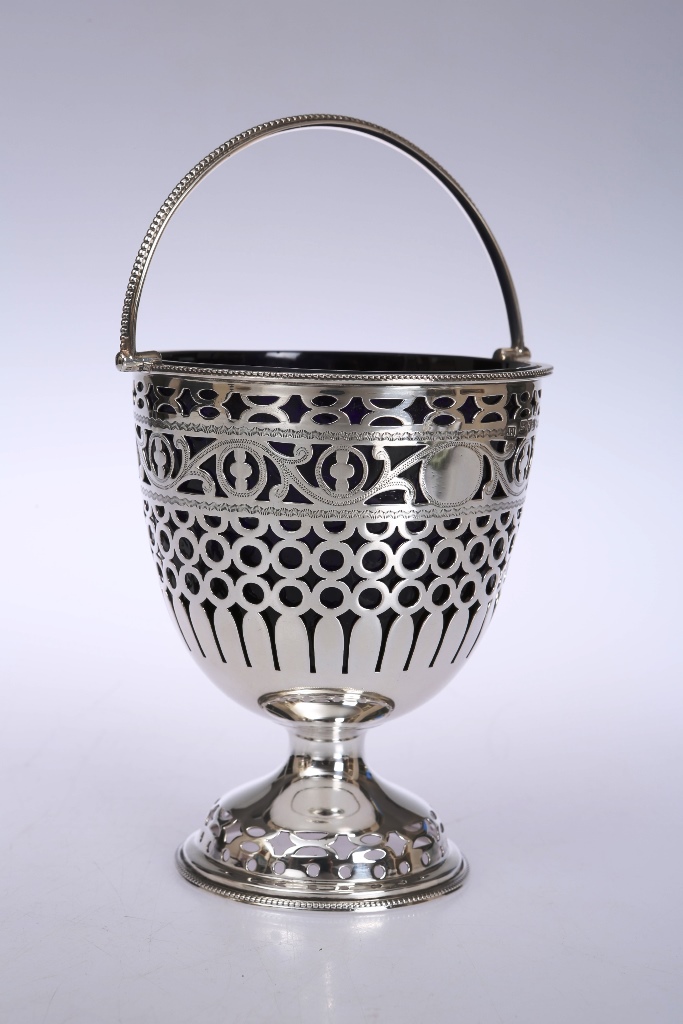 An Edwardian silver sugar basket, Jay, Richard Attenborough Co Ltd, Chester 1904, of pedestal form