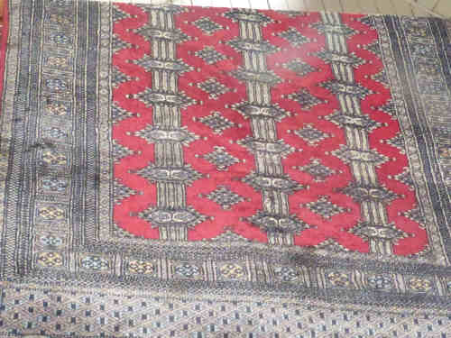 Red Ground Geometric Design Wool Rug, 1.90m x 1.25m