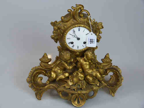 Ornate Gilt Metal Mantel Clock Decorated with Cherubs with Enamel Dial