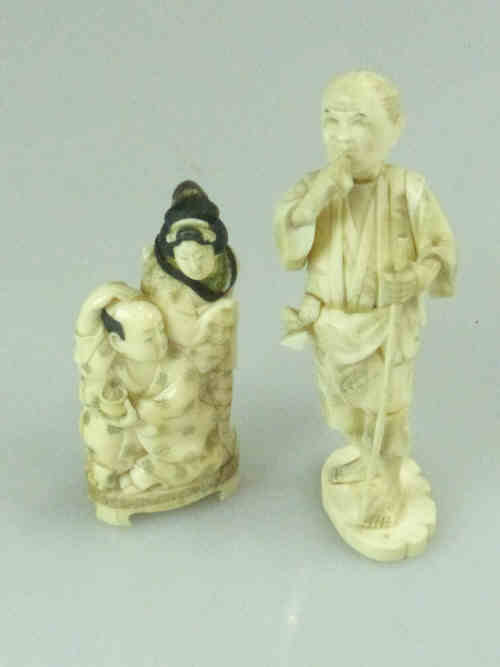 Japanese Carved Ivory Okimono and a Figure Group (2)