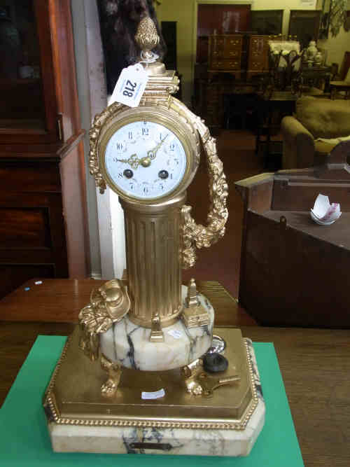 French Gilt Metal Striking Mantel Clock on Central Column with Floral Decoration