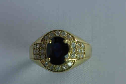 Oval Sapphire and Twenty Eight Diamond Cluster Ring, Set in 9ct Gold