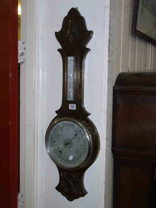 Carved Oak Aneroid Barometer with silvered dial