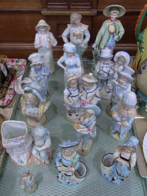 A Collection of Fifteen Bisque Figures