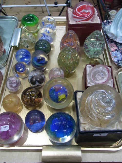 A Collection of Twenty Four Glass Paperweights