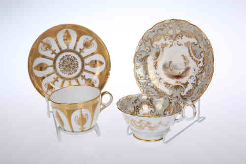 A Sevres style gilded porcelain cup and saucer, probably Coalport, with "cut-out" Classical