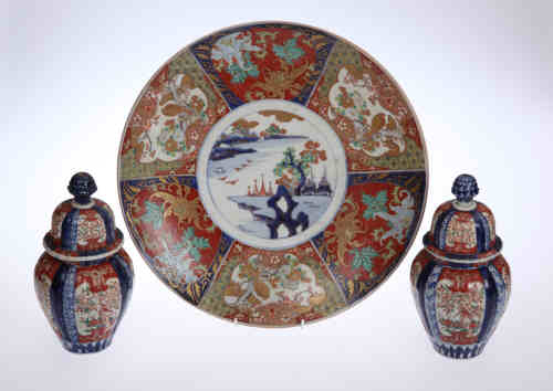 An Imari charger, c.1900, the central panel painted with an island, within a six panel alternating