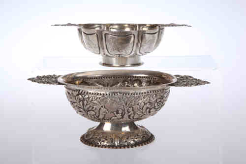 A Dutch silver brandy bowl, 19th century, of lobed form, primitively engraved with figural panels.