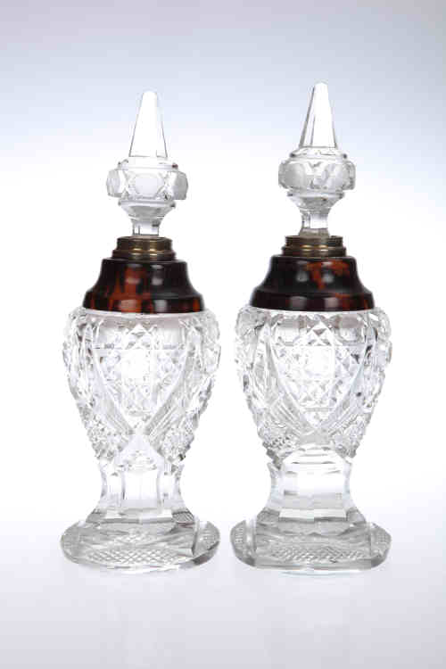 A large pair of silver and tortoiseshell collared cut-glass scent bottles, London 1925, of