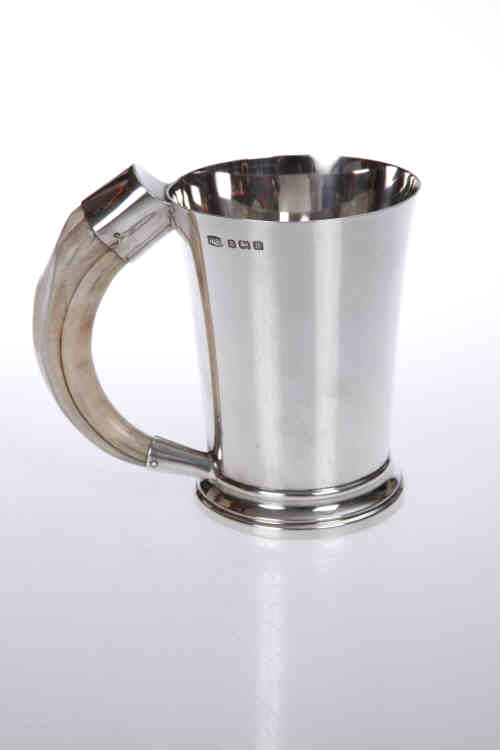 A George VI silver tankard, Hukin & Heath, Birmingham 1941, of tapering cylindrical form, with