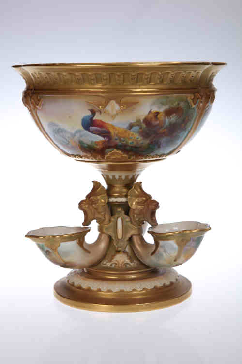 A Royal Worcester centrepiece, painted by J. Southall, the bowl with three panels, two painted