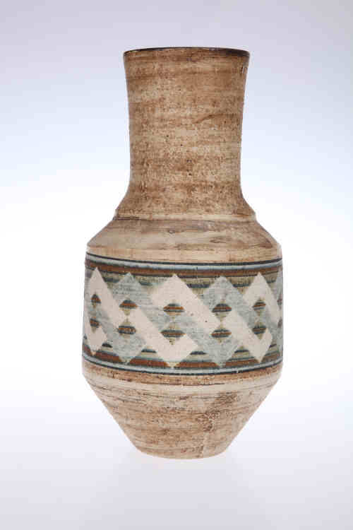 A Troika pottery vase, decorated by Penny Black with interlocked squares, black painted marks. 25.