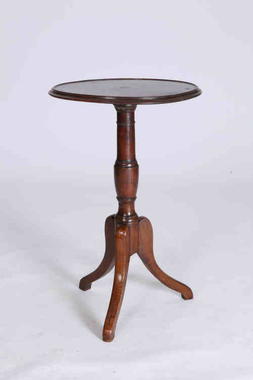 A 19th century tripod table, the dished moulded circular rosewood top above an oak turned and ringed