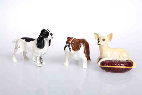 A group of Beswick models of dogs, comprising cocker spaniel, no. 967, black and white gloss;