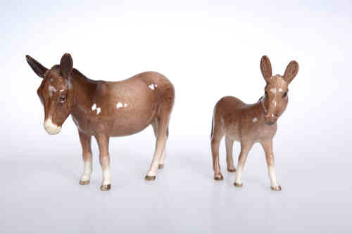 A Beswick model of a donkey, no. 2267A, gloss; together with a Beswick model of a donkey foal, no.